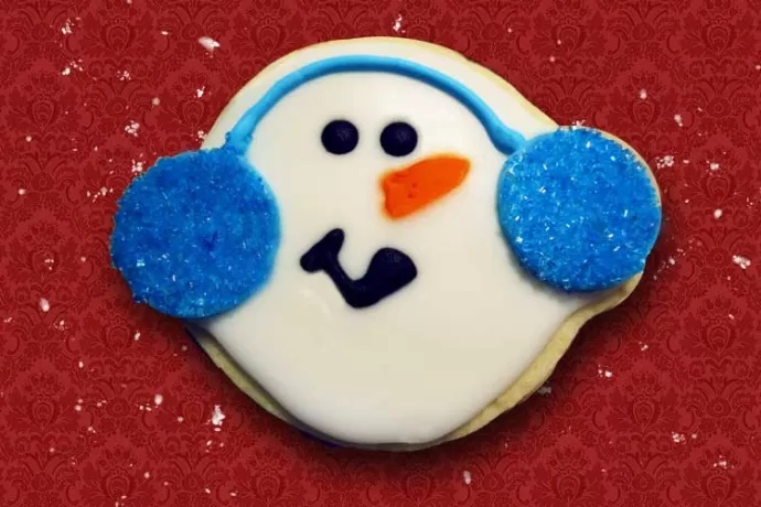 Snowman with blue ear muffs